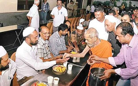 Sri Vishwesha Thirtha swamiji hosting an iftar event at the dining hall of Krishna temple in Udupi on Monday  | Express File photo