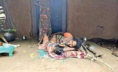 A woman and her child suffering from viral fever wait for medical aid in Chaparai village of East Godavari district. Officials had, so far, tried to downplay the spike in the number cases of communicable diseases in the region | Express