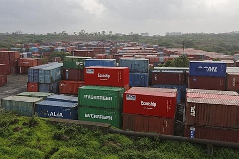 Cargo containers are seen stacked outside the container terminal of Jawaharlal Nehru Port Trust (JNPT) in Mumbai, India. (File photo |  Reuters)