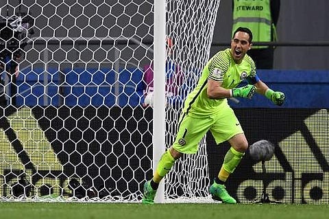 Chile's goalkeeper Claudio Bravo celebrates after Chile won the 2017 Confederations Cup semi-final football match in a penalty shoot out against Portugal at the Kazan Arena. | AFP