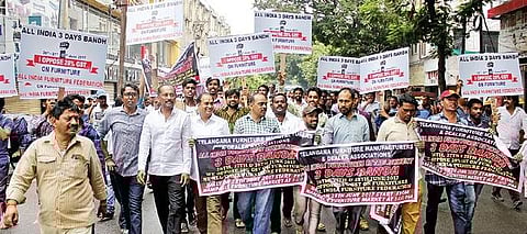 Telangana furniture manufacturers and traders take out a rally against implementation of GST at Nampally in Hyderabad on Wednesday | Sathya Keerthi