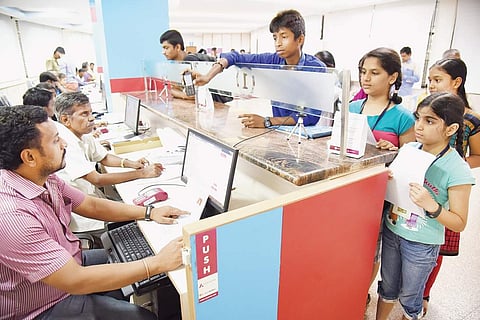 Students are forced to stand in queues for hours to get hold of their smart card passes | Nagaraja Gadekal