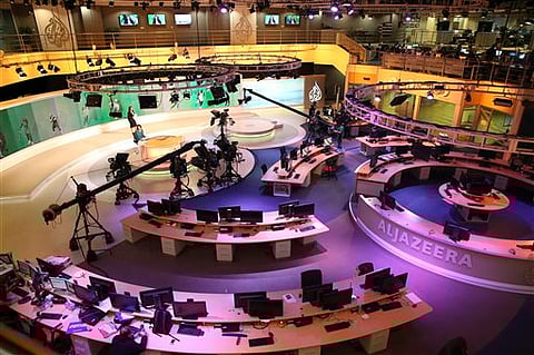 Staff members of Al-Jazeera International work at the news studio in Doha, Qatar. |File Photo: AP