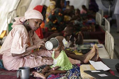 A mother feeds her malnourished child at a feeding centre run by Doctors Without Borders in Maiduguri, Nigeria. | AP