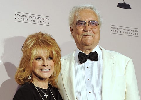 Actress Ann-Margret poses with her husband Roger Smith in the press room at the Creative Arts Emmy Awards in Los Angeles. (AP)