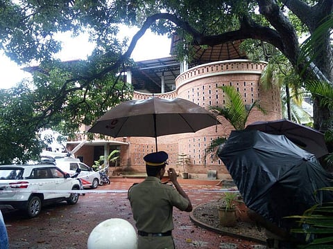 Police deployed at the CPM district committee office where  RSS members allegedly hurled bombs at district secretary P Mohanan. (EPS | A Sanesh)