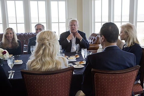 President Donald Trump and members of his cabinet and the White House staff, Saturday, March 11, 2017, at the Trump National Golf Club in Sterling | AP