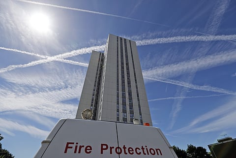 A Fire protection car stands in front of Bray Tower, part of the Chalcots Estate in the borough of Camden, in London, Monday, June 26, 2017. (AP)