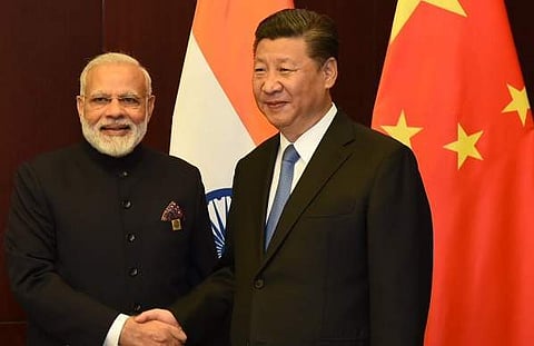 Indian PM Narendra Modi meets President of China XiJinping on margins of SCO Summit in Astana. (Photo: Twitter via @MEAIndia