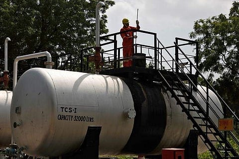 A technician works inside the Oil and Natural Gas Corp (ONGC) group gathering station on the outskirts of Ahmedabad