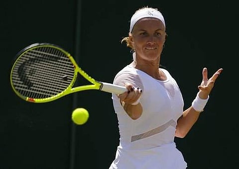 Russia's Svetlana Kuznetsova returns to Poland's Agnieszka Radwanska during their Women's Singles Match on day seven at the Wimbledon. | AP