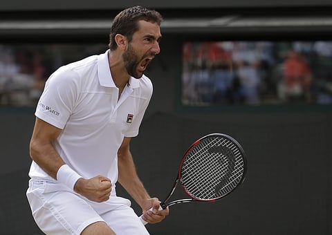 Croatia's Marin Cilic celebrates after winning a point against Luxembourg's Gilles Muller during their Men's Singles Quarterfinal Match. | AP