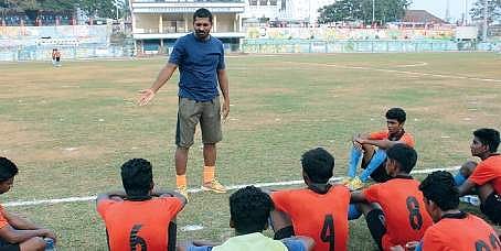Former Kerala state footballer Ebin Rose training young footballers in the city