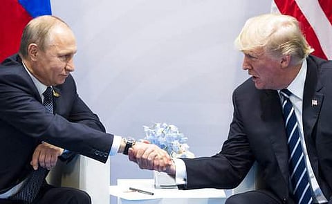 U.S. President Donald Trump, right, and Russian President Vladimir Putin shake hands during the G20 summit in Hamburg Germany, Friday July 7, 2017.  | AP
