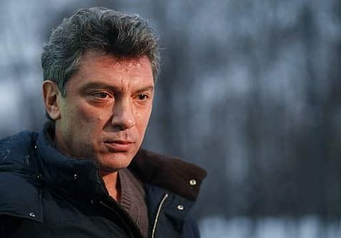 In this Dec. 21, 2011 file photo, Boris Nemtsov, an opposition leader, speaks to The Associated Press Television News in Moscow, Russia. A jury on Thursday June 29, 2017 have found five men guilty in the assassination of Russian opposition leader Boris Ne