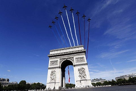 France's annual Bastille Day parade turned into an event high on American patriotism this year, as it also commemorated the 100th anniversary of America's entry into World War I. French war planes fly over the Arc de Triomphe  during the Bastille Day parade in Paris.