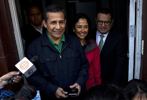 Peru's former President Ollanta Humala and his wife Nadine Heredia stop to talk with journalists as they leave the headquarters of Peru's National Party where they met with their lawyers, in Lima, Thursday, July 13, 2017.