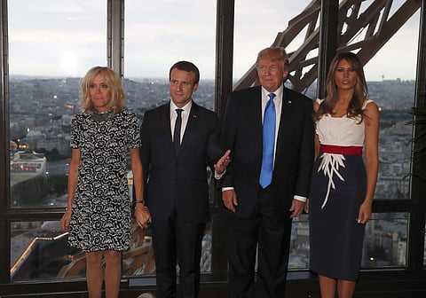 From left to right : Brigitte Macron, wife of French President Emmanuel Macron, Emmanuel Macron, U.S. President Donald Trump and First lady Melania Trump pose at the Jules Verne restaurant before a private dinner at the Eiffel Tower in Paris, France, Thur