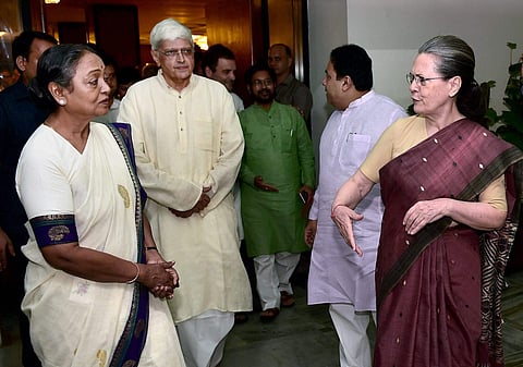 Congress President Sonia Gandhi with presidential candidate Meira Kumar and vice-presidential candidate Gopal Krishna Gandhi after the UPA meeting in New Delhi on Sunday. | PTI
