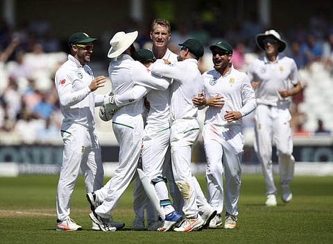 South Africa's Chris Morris celebrates with team-mates after dismissing England's Alastair Cook during day four of the Second Test cricket match at Trent Bridge. | AP