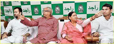 RJD Chief Lalu Prasad Yadav with wife Rabri Devi and Bihar deputy chief minister Tejaswi Yadav (L) at a Legislative party meeting in Patna. (Photo| PTI)
