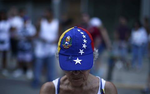 Venezuela opposition's call for a fake referendum as means of symbolic rejection of President Nicolas Maduro's plan to rewrite the constitution led to nearly 7.2 million --of 19 million possible voters-- turning up to cast their ballots on Sunday.  A woman wearing a cap with the Venezuela flag attends a symbolic referendum in Barcelona, Spain.