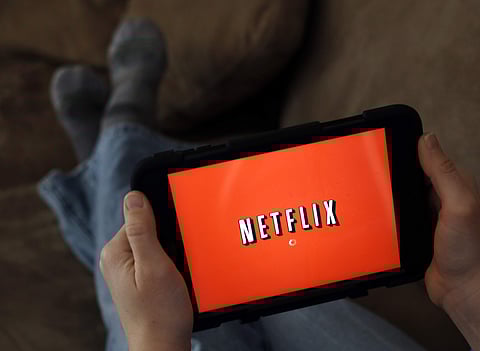 In this Friday, Jan. 17, 2014, file photo, a person displays Netflix on a tablet in North Andover, Mass. Netflix, Inc. reports financial results, Monday, July 17, 2017. (AP Photo/Elise Amendola, File)