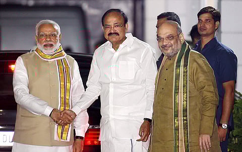 Union Minister M. Venkaiah Naidu with Prime Minister Narendra Modi and BJP President Amit Shah after he was announced as the BJP's Vice-Presidential candidate in New Delhi on Monday.(PTI)