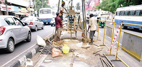 Workers conduct soil testing for the steel bridge near Shivananda Circle | nagaraja gadekal