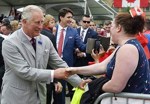 Britain's Prince Charles and Canada's Prime Minister Justin Trudeau greet people during Canada 150 celebrations in Ottawa, Ontario, on Saturday, July 1, 2017. (photo | AP)
