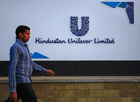 A pedestrian walks past the Hindustan Unilever Limited (HUL) headquarters in Mumbai. (File Photo | Reuters)