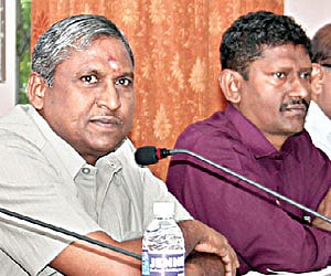 IAS officer U Sagayam (R) sitting next to State Election Commissioner S Ayyar.