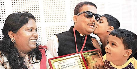 Kempahonnaiah with his wife and children after felicitation in Bengaluru  | NAGESH POLALI