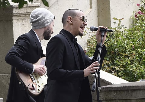 FILE - In this May 26, 2017 file photo, Chester Bennington, of Linkin Park, performs 'Hallelujah' at a funeral for Chris Cornell at the Hollywood Forever Cemetery in Los Angeles. The Los Angeles County coroner says Bennington, who sold millions of albums 