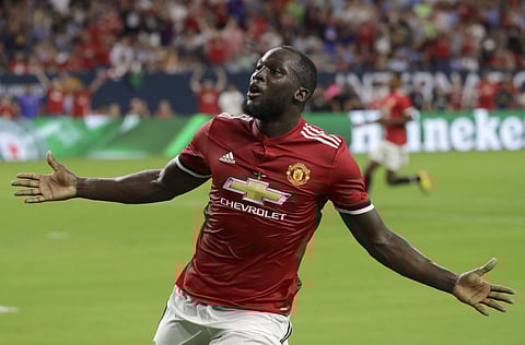 Manchester United's Romelu Lukaku reacts to scoring a goal against Manchester City during the first half of an International Champions Cup soccer match in Houston. | AP