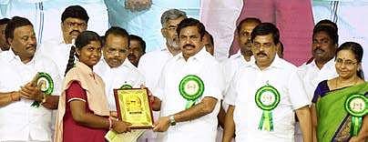 CM Edappadi K Palaniswami giving away an award to a government school student in Tirupur district on Saturday | Express