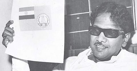 File picture of the then Chief Minister M Karunanidhi displaying the proposed State flag in 1970