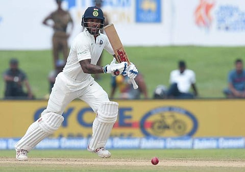 Indian cricketer Shikar Dhawan plays a shot during the first day of first Test match between Sri Lanka and India at Galle International Cricket Stadium in Galle. (AFP)