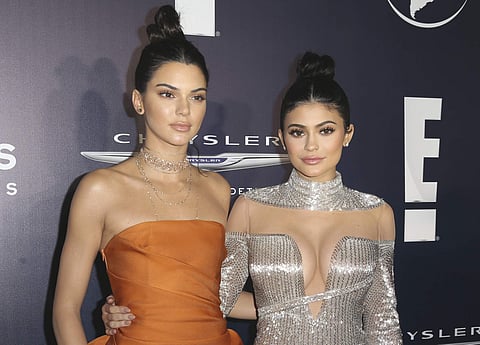 FILE - In this Jan. 8, 2017, file photo, Kendall Jenner, left, and Kylie Jenner arrive at the NBCUniversal Golden Globes afterparty in Beverly Hills, Calif. The Jenner sisters' fashion label, Kendall + Kylie, said Sunday, July 9, that it sold only two 'vi