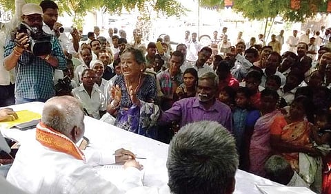 Relative of one of the victim talks to the members of National SC, ST Commission at Nerella village in Rajanna-Sircilla district on Wednesday | Express photo