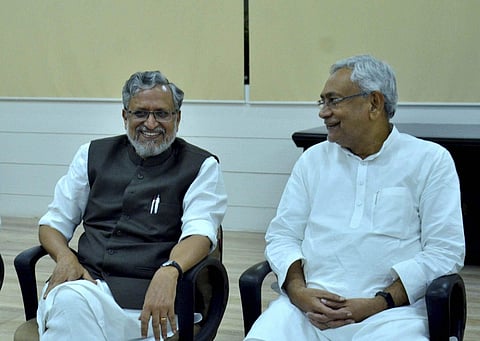 Bihar Chief Minister Nitish Kumar with senior leader of BJP Sushil Kumar Modi at legislators meeting in Patna on Wednesday. | PTI