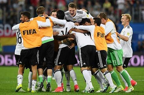 Germany's players celebrate winning the 2017 Confederations Cup final football match between Chile and Germany at the Saint Petersburg Stadium in Saint Petersburg on July 2, 2017. | AFP