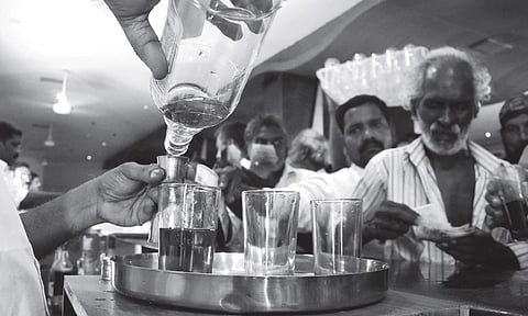 Tipplers crowded at the reopened bar at Attakulangara in Thiruvananthapuram after the new liquor policy by the LDF Government | B P Deepu