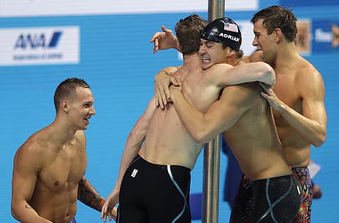 United States' Caeleb Dressel, Kevin Cordes, Nathan Adrian and Matt Grevers, from left, celebrate after winning the gold medal in the men's 4x100-meter medley relay final during the swimming competitions of the World Aquatics Championships in Budapest, Hu