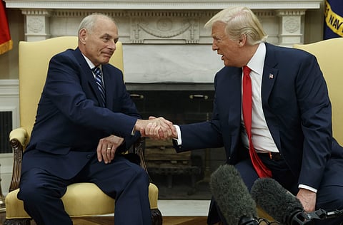President Donald Trump talks with new White House Chief of Staff John Kelly after he was privately sworn in during a ceremony in the Oval Office with President Donald Trump on Monday. (Photo | AP)