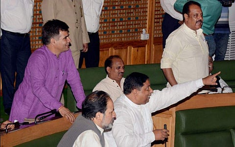 BJP MLAs shout in support of their demand to implement Goods and Services Tax GST during the Special Session of Legislative Assembly called to pass the GST bill in Srinagar on Wednesday. (PTI)