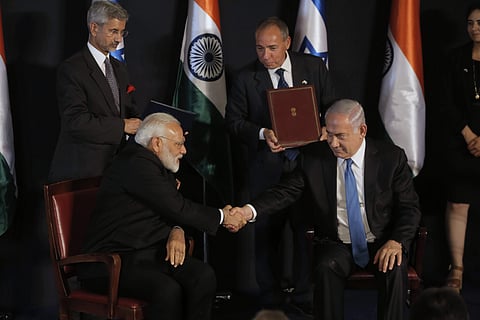 Indian Prime Minister Narendra Modi, left, shakes hands with Israeli Prime Minister Benjamin Netanyahu during their meeting at the King David hotel in Jerusalem, Wednesday, July 5, 2017. | AP