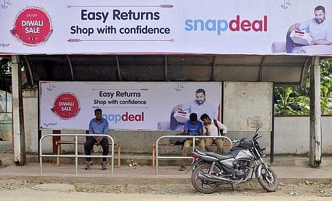Snap deal hoarding at a bus stop. Reuters