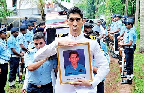 Air force officers pay ceremonial homage to Flight Lt S Achudev at his ancestral home in Pantheeramkavu. (File | EPS)