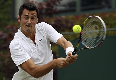 Bernard Tomic was hit with a 15,000 US dollars fine after the temperamental Australian claimed he was 'bored' during his lacklustre Wimbledon first round defeat against Mischa Zverev. | AP